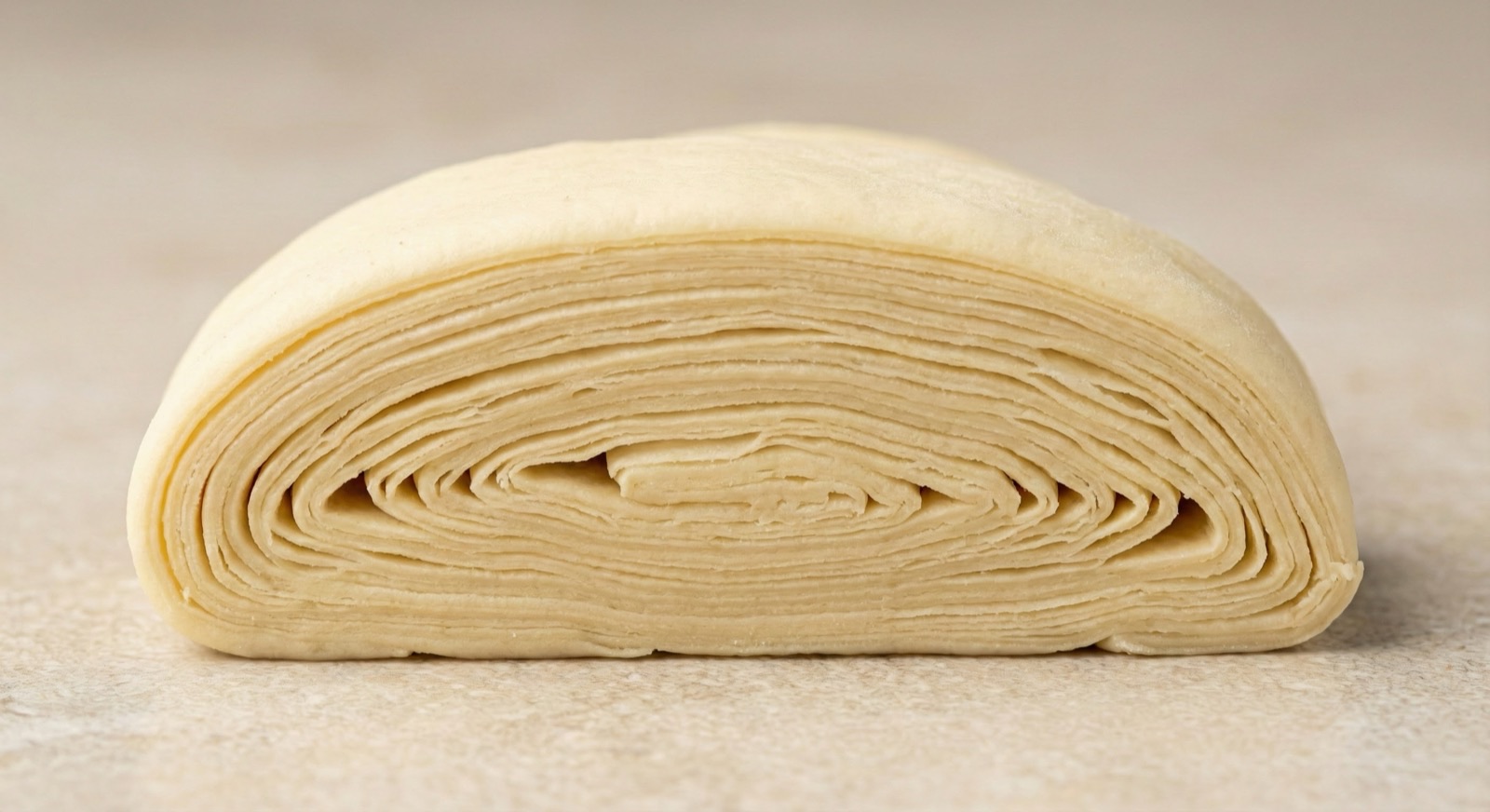Raw croissant laminated dough layers